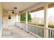 Relaxing covered porch offering a scenic view of lush landscaping and pond at 10620 Staghound Trl, Zebulon, NC 27597
