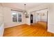 Formal dining room boasts hardwood floors, crown molding, and ample natural light at 10620 Staghound Trl, Zebulon, NC 27597