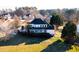 Charming two-story home featuring a well-manicured lawn and mature trees providing natural shade at 10620 Staghound Trl, Zebulon, NC 27597