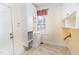 Convenient laundry room with built-in cabinets, sink, and ample storage space at 10620 Staghound Trl, Zebulon, NC 27597