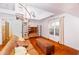 Bright, airy living room with hardwood floors, natural light, and a spiral staircase at 10620 Staghound Trl, Zebulon, NC 27597