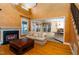 Inviting living room featuring a fireplace, hardwood floors, and an open layout into the bright kitchen area at 10620 Staghound Trl, Zebulon, NC 27597