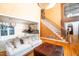 Bright and airy living room showcases hardwood floors, staircase, and open access to the kitchen at 10620 Staghound Trl, Zebulon, NC 27597