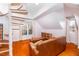 Charming living room features a spiral staircase, skylight, and ample natural light at 10620 Staghound Trl, Zebulon, NC 27597