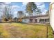 Spacious backyard with a well-maintained lawn, patio, and gazebo, perfect for outdoor activities and relaxation at 1107 S 2Nd St, Smithfield, NC 27577