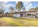 Expansive backyard featuring a gazebo, covered patio with seating, and ample green space for various activities at 1107 S 2Nd St, Smithfield, NC 27577
