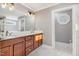 Spacious bathroom featuring double vanity, wood cabinets, and access to shower and tub at 1107 S 2Nd St, Smithfield, NC 27577