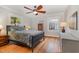 Bedroom featuring a ceiling fan and natural light from the bright double-hung windows at 1107 S 2Nd St, Smithfield, NC 27577