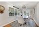 Inviting dining area with a large window, a round wooden table, and seating for six at 1107 S 2Nd St, Smithfield, NC 27577