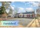 Charming brick home featuring a well-manicured lawn and traditional architectural details at 1107 S 2Nd St, Smithfield, NC 27577