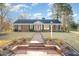 Inviting brick home featuring a symmetrical design, classic shutters, and a welcoming brick pathway to the front door at 1107 S 2Nd St, Smithfield, NC 27577