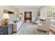 Bright living room with hardwood floors, comfortable seating, and large windows for ample natural light at 1107 S 2Nd St, Smithfield, NC 27577