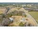 Aerial view of property showing home, barn, and surrounding land at 1304 Nc 96 Hwy S, Zebulon, NC 27597