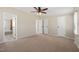 Bedroom with neutral colored walls, multiple closets, and a ceiling fan at 1304 Nc 96 Hwy S, Zebulon, NC 27597