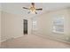 Bedroom with neutral colored walls, closet, and a ceiling fan at 1304 Nc 96 Hwy S, Zebulon, NC 27597