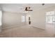 Spacious bedroom with neutral paint, ceiling fan, and ample natural light streaming through the window at 1304 Nc 96 Hwy S, Zebulon, NC 27597