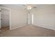 Spacious carpeted bedroom featuring ceiling fan, ample outlets, and a closet, offering comfort and practicality at 1304 Nc 96 Hwy S, Zebulon, NC 27597