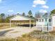 View of carport connected to the home, providing covered parking at 1304 Nc 96 Hwy S, Zebulon, NC 27597