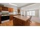 Kitchen island with cabinets and seating in an open space at 1304 Nc 96 Hwy S, Zebulon, NC 27597
