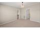 Inviting living room with neutral walls, carpeting, and open doorways, creating a seamless flow at 1304 Nc 96 Hwy S, Zebulon, NC 27597