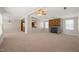 Open living room with fireplace featuring a stone surround and exposed brick accents at 1304 Nc 96 Hwy S, Zebulon, NC 27597
