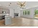 Spacious living room features a modern fireplace, hardwood floors, and ample natural light from large windows at 136 E End Ave # 4, Durham, NC 27703