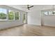 Sunlit room featuring hardwood floors and large windows at 136 E End Ave # 4, Durham, NC 27703
