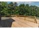 Wide wooden back deck with wooden railings and stairs leading to the yard at 140 E End Ave # 2, Durham, NC 27703