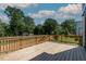 The spacious wooden deck offers space for outdoor entertaining with a view of the yard at 140 E End Ave # 2, Durham, NC 27703