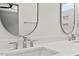 Close-up of bathroom featuring double sinks and modern faucets at 140 E End Ave # 2, Durham, NC 27703