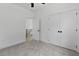 A bedroom features light gray carpet, double doors that lead to the hallway and a ceiling fan at 140 E End Ave # 2, Durham, NC 27703