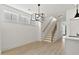 Dining area with stylish light fixture and view of modern staircase at 140 E End Ave # 2, Durham, NC 27703