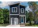 Beautiful exterior of a modern home with a striking blue front door and attached garage at 140 E End Ave # 2, Durham, NC 27703