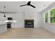 Open concept kitchen and living room with fireplace and natural light at 140 E End Ave # 2, Durham, NC 27703