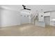 Open living room with hardwood floors, modern lighting, and staircase access at 140 E End Ave # 2, Durham, NC 27703