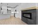 Living room with fireplace and open concept kitchen at 140 E End Ave # 2, Durham, NC 27703