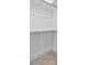 Empty walk-in closet featuring carpet and wooden rails at 140 E End Ave # 2, Durham, NC 27703