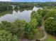 Scenic aerial view of a community lake, with lush green trees enhancing the tranquil atmosphere at 1400 Gathering Park Cir # 202, Cary, NC 27519