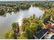 Aerial view showcasing a lake surrounded by lush trees near the homes at 1400 Gathering Park Cir # 202, Cary, NC 27519