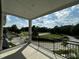 Peaceful community view from the balcony overlooking landscaped lawns and neighborhood streets at 1400 Gathering Park Cir # 202, Cary, NC 27519