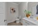 Well-lit bathroom featuring a modern vanity with white cabinets and stylish decor at 1400 Gathering Park Cir # 202, Cary, NC 27519