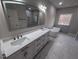 Bright bathroom with double vanity, soaking tub, and marble floors at 1400 Gathering Park Cir # 202, Cary, NC 27519