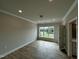 Bright bedroom featuring hardwood floors, recessed lighting, and large windows at 1400 Gathering Park Cir # 202, Cary, NC 27519