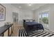 Cozy bedroom with a queen-size bed, and access to a private balcony at 1400 Gathering Park Cir # 202, Cary, NC 27519