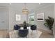 Cozy dining area with a modern table, comfortable seating, and backyard views at 1400 Gathering Park Cir # 202, Cary, NC 27519