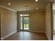 Dining area with access to the outside and stylish light fixture at 1400 Gathering Park Cir # 202, Cary, NC 27519