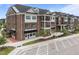 Beautiful brick building exterior featuring black awnings and convenient parking spaces at 1400 Gathering Park Cir # 202, Cary, NC 27519