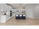 Bright kitchen with white cabinetry, stainless steel appliances, and a navy blue center island at 1400 Gathering Park Cir # 202, Cary, NC 27519