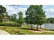 Enjoy the charming gazebo overlooking the lake and landscaped green space at 1400 Gathering Park Cir # 202, Cary, NC 27519