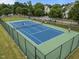 Aerial view of fenced tennis courts surrounded by well-maintained landscaping at 1400 Gathering Park Cir # 202, Cary, NC 27519
